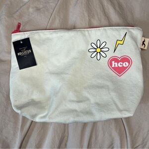Hollister White Pouch with Fun Patches
